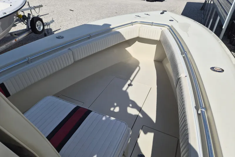 Slide: The Image of 2008 Contender 23 Tournament boat interior with seating and storage compartments. - 9