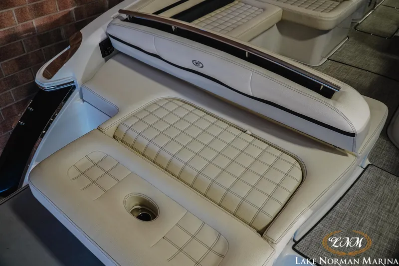 Slide: The Image of 2020 Cobalt R7 Surf boat interior with beige cushioned seating at Lake Norman Marina. - 11