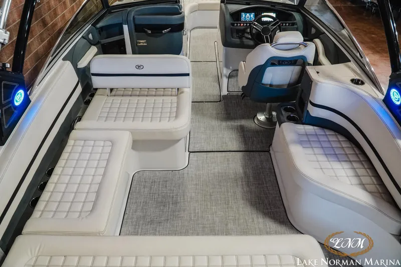 Slide: The Image of Interior of a 2020 Cobalt R7 Surf boat with luxurious seating and modern dashboard. - 12