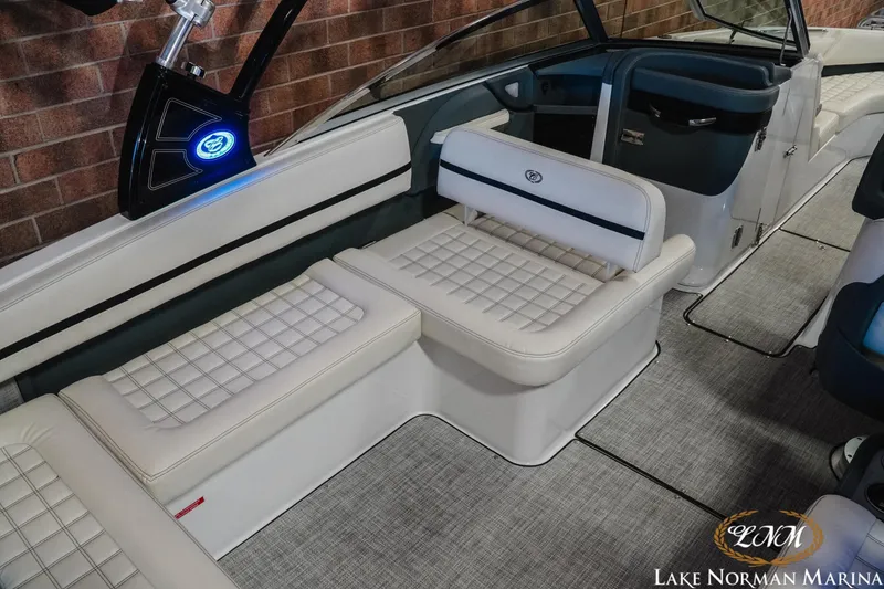 Slide: The Image of 2020 Cobalt R7 Surf boat interior with white cushioned seating and modern design. - 13