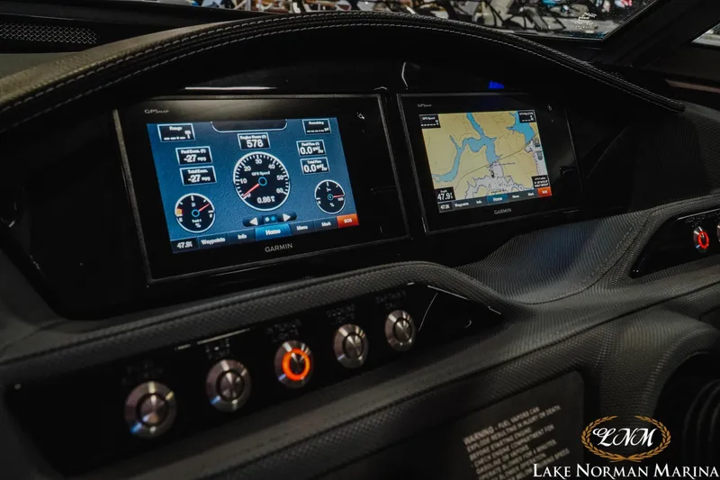 Slide: The Image of Dashboard of a 2020 Cobalt R7 Surf boat with Garmin navigation displays. - 18