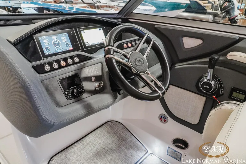 Slide: The Image of 2020 Cobalt R7 Surf boat dashboard with steering wheel and control panel. - 19
