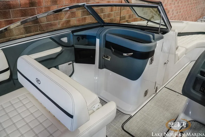 Slide: The Image of 2020 Cobalt R7 Surf boat interior with white and blue seating, Lake Norman Marina. - 20