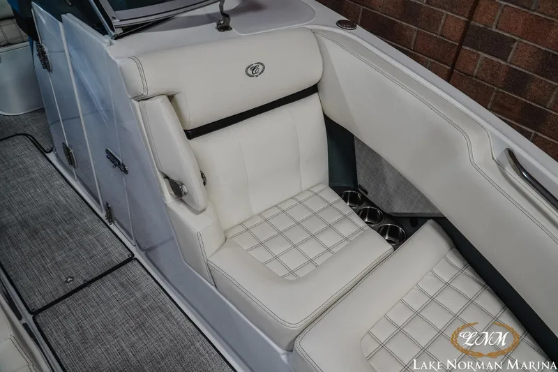 Slide: The Image of 2020 Cobalt R7 Surf boat interior with white cushioned seating at Lake Norman Marina. - 24