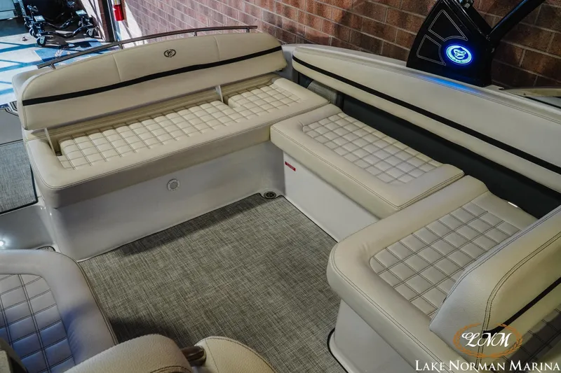 Slide: The Image of 2020 Cobalt R7 Surf boat interior with beige cushioned seating, Lake Norman Marina. - 27