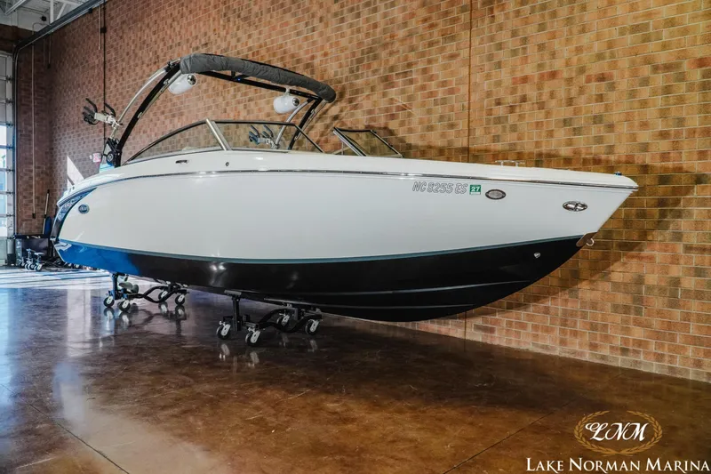 Slide: The Image of 2020 Cobalt R7 Surf boat displayed indoors at Lake Norman Marina. - 3