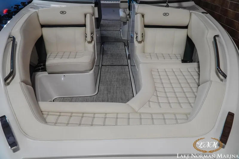 Slide: The Image of 2020 Cobalt R7 Surf boat interior with luxurious white seating and elegant design. - 5