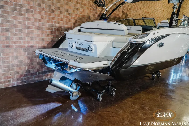 Slide: The Image of 2020 Cobalt R7 Surf boat displayed indoors at Lake Norman Marina. - 6