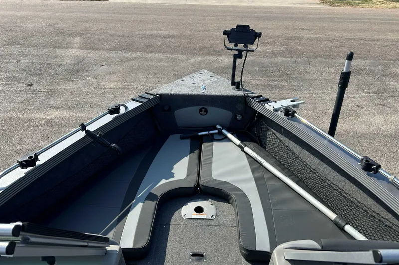 Slide: The Image of Interior view of a 2018 Lund 2075 Tyee boat, showcasing seating and equipment. - 6