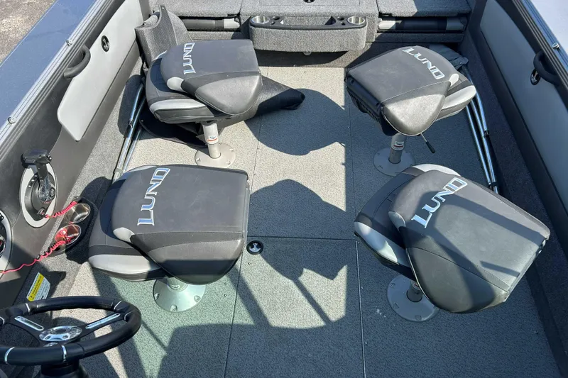 Slide: The Image of Interior of a 2018 Lund 2075 Tyee boat with four swivel seats. - 9