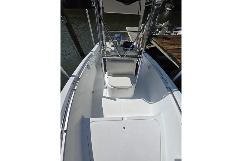 Slide: The Image of 2003 Sea Pro 206 Center Console boat interior with seating and console view. - 2