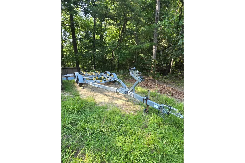 Slide: The Image of Trailer for 2003 Sea Pro 206 Center Console in wooded area. - 4