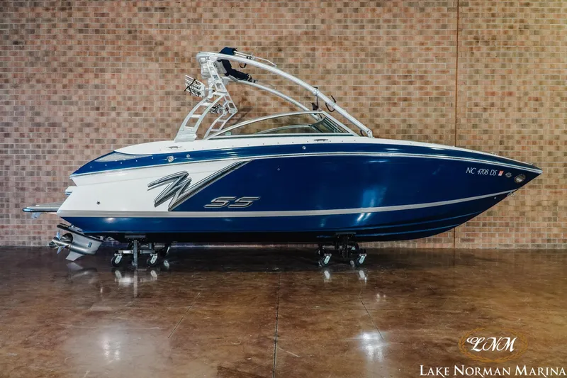 The Image of 2011 Cobalt 242 WSS boat in showroom, blue and white design, Lake Norman Marina. - 0