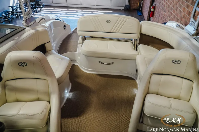 Slide: The Image of Interior of a 2011 Cobalt 242 WSS boat with beige leather seating. - 16