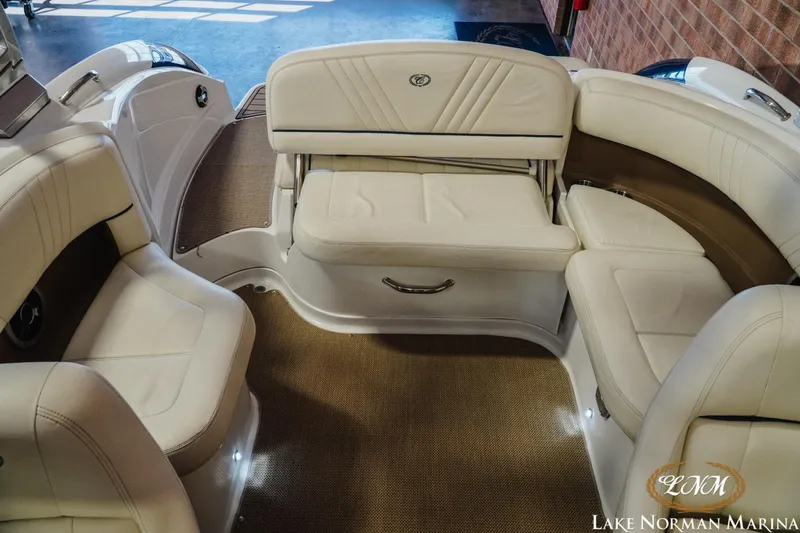 Slide: The Image of Interior of a 2011 Cobalt 242 WSS boat with beige seating. - 17