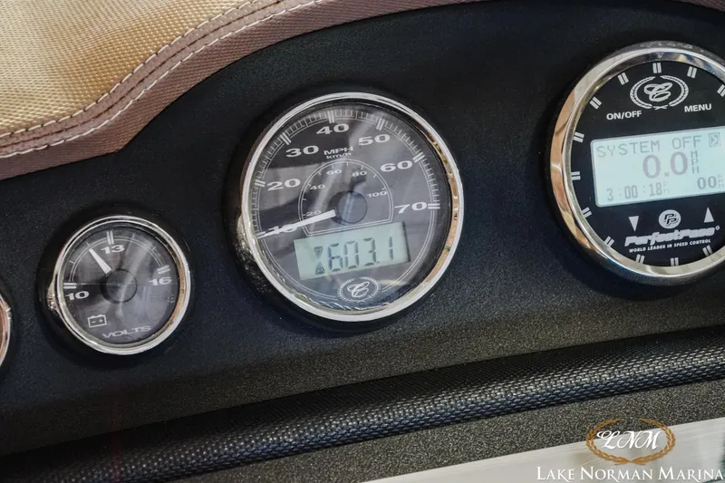 Slide: The Image of Dashboard of a 2011 Cobalt 242 WSS boat with speedometer and voltmeter. - 21