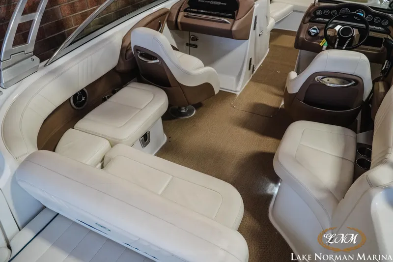 Slide: The Image of Luxurious interior of 2011 Cobalt 242 WSS boat with plush seating and modern dashboard. - 9