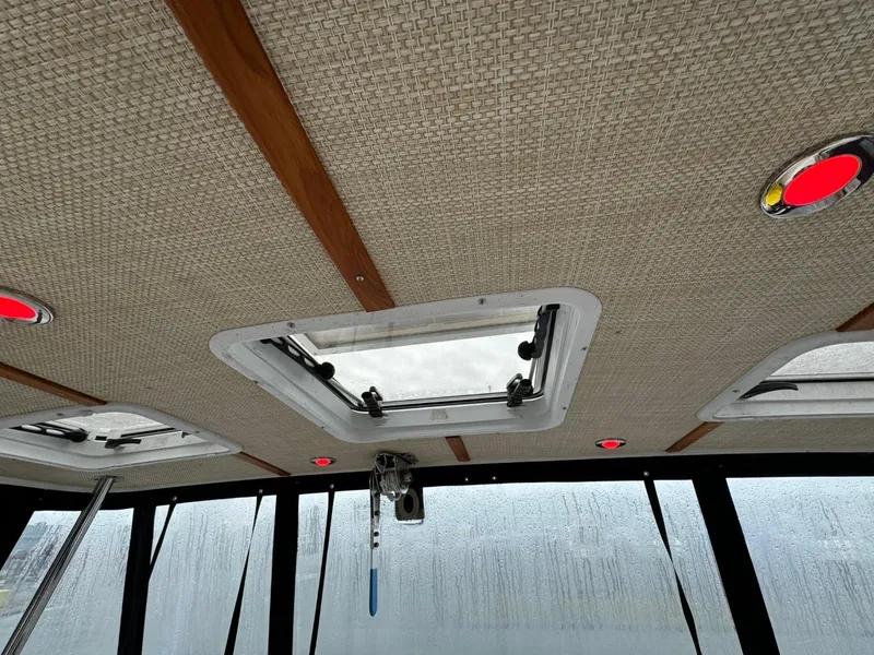 Slide: The Image of 2018 Ranger Tugs R-31S Ranger Tug interior ceiling with hatch and windows. - 14