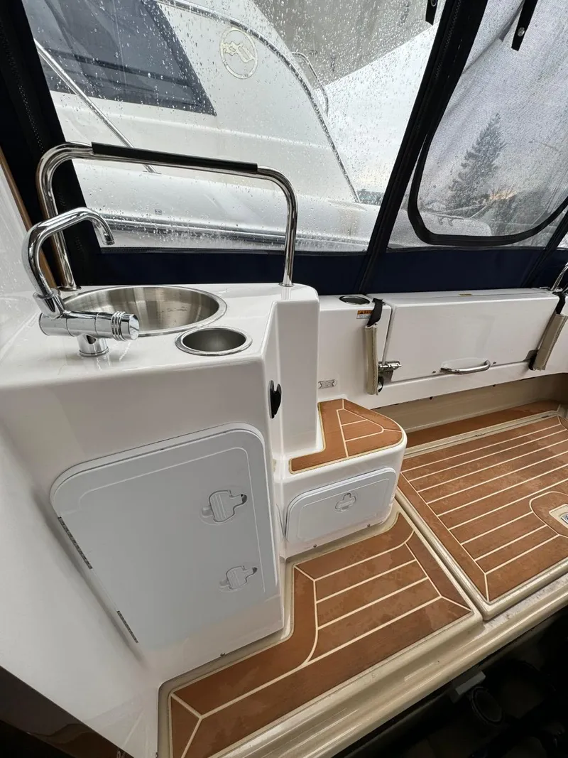 Slide: The Image of 2018 Ranger Tugs R-31S Ranger Tug interior with sink and storage compartments. - 16