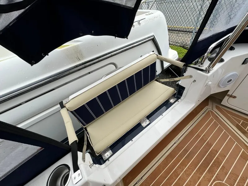 Slide: The Image of 2018 Ranger Tugs R-31S Ranger Tug, rear seating area with striped cushion. - 17