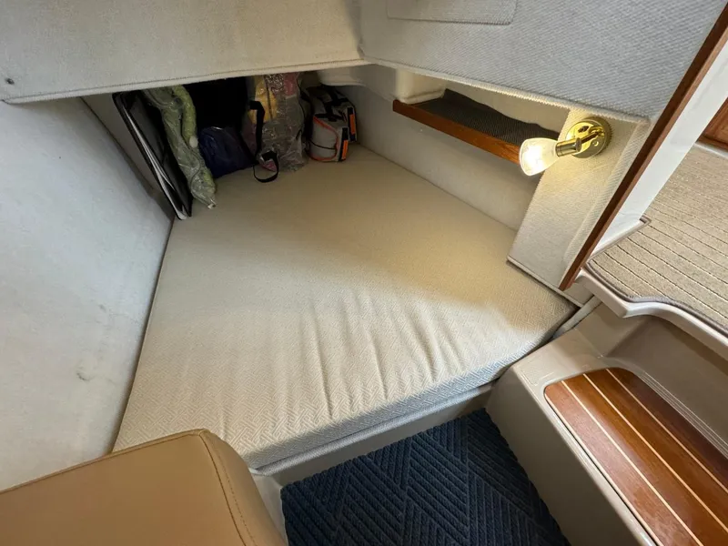Slide: The Image of 2018 Ranger Tugs R-31S Ranger Tug cabin interior with bed and storage. - 22