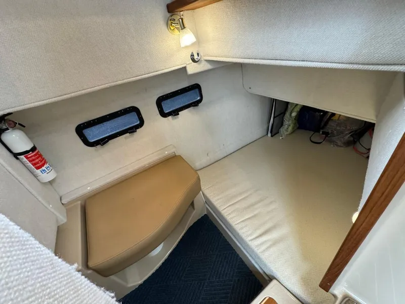 Slide: The Image of 2018 Ranger Tugs R-31S Ranger Tug cabin interior with seating and windows. - 23