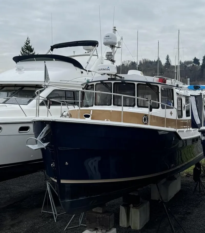Slide: The Image of 2018 Ranger Tugs R-31S Ranger Tug boat docked on land. - 3