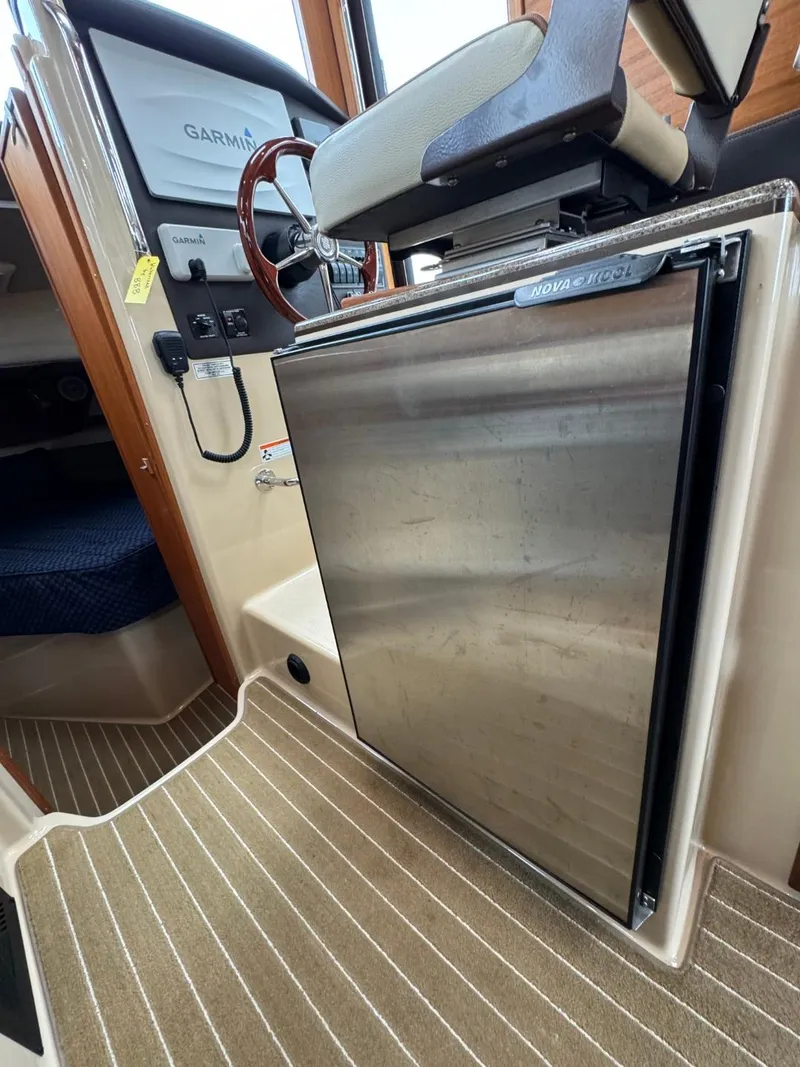 Slide: The Image of 2018 Ranger Tugs R-31S Ranger Tug interior with stainless steel refrigerator. - 30