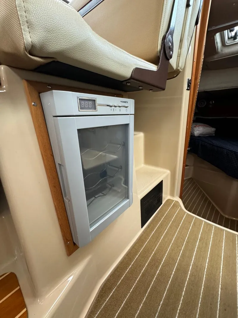 Slide: The Image of 2018 Ranger Tugs R-31S Ranger Tug interior with built-in refrigerator. - 31