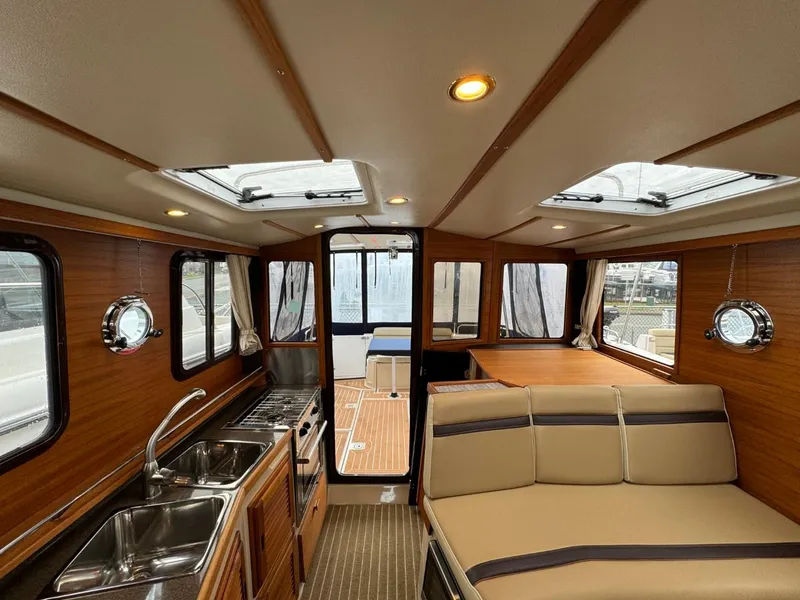 Slide: The Image of 2018 Ranger Tugs R-31S Ranger Tug interior with kitchen and seating area - 32