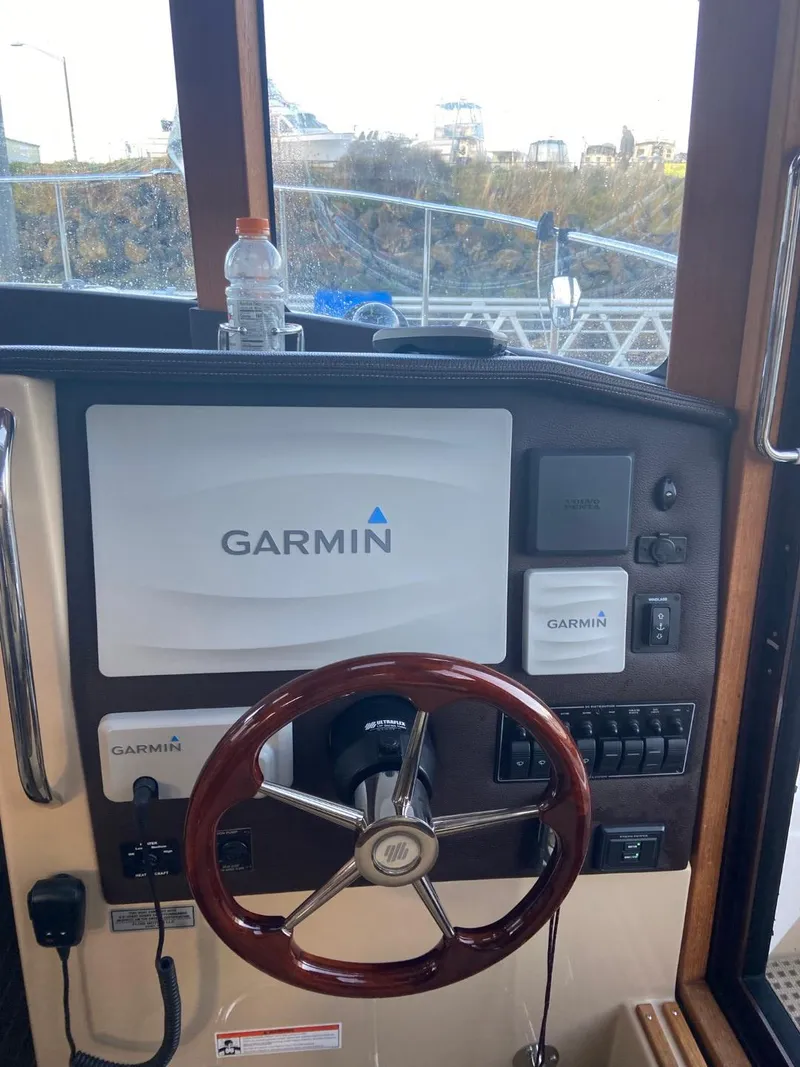 Slide: The Image of 2018 Ranger Tugs R-31S Ranger Tug helm with Garmin navigation system. - 35