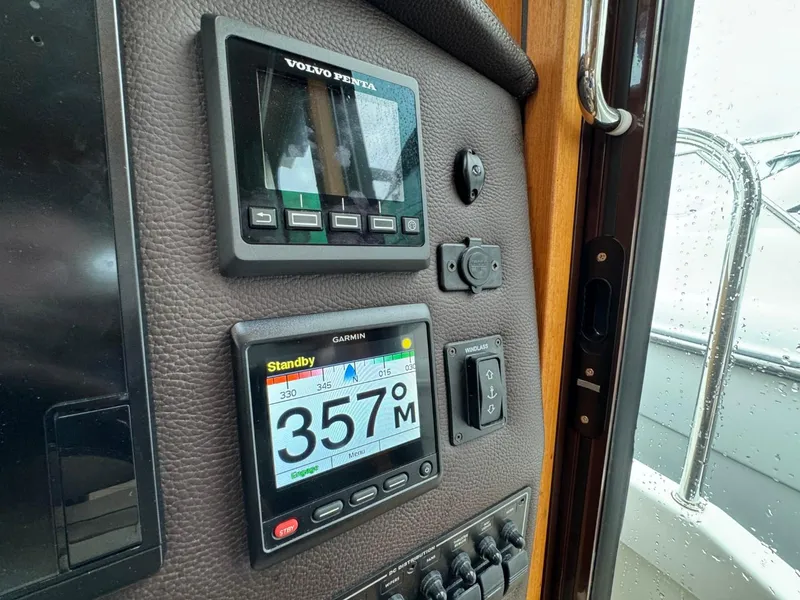 Slide: The Image of Control panel of a 2018 Ranger Tugs R-31S Ranger Tug with Volvo Penta and Garmin displays. - 39