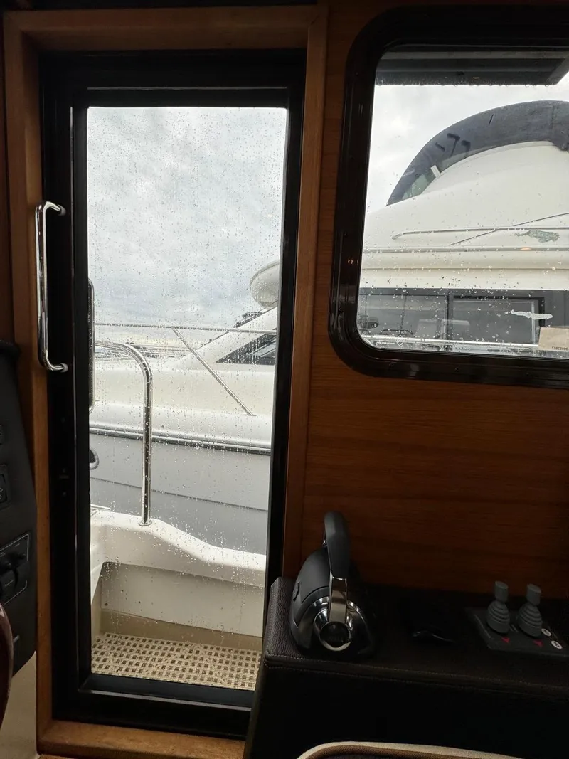 Slide: The Image of Interior view of 2018 Ranger Tugs R-31S Ranger Tug with door and window. - 45