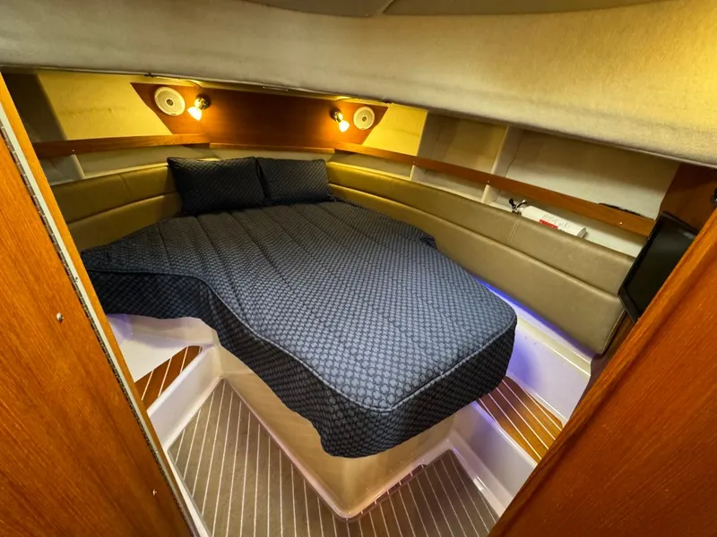 Slide: The Image of 2018 Ranger Tugs R-31S Ranger Tug cabin with bed and ambient lighting. - 48