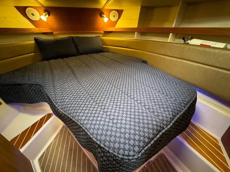 Slide: The Image of 2018 Ranger Tugs R-31S Ranger Tug cabin interior with bed and lighting. - 49