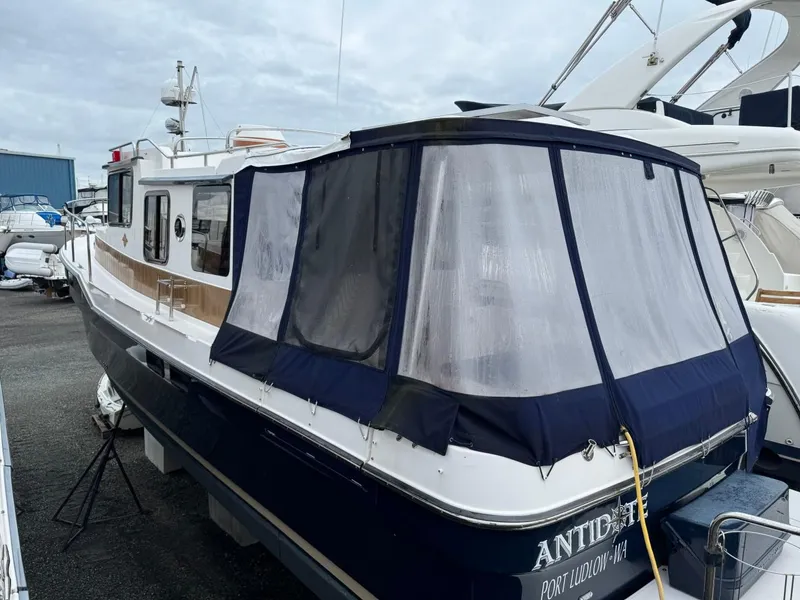 Slide: The Image of 2018 Ranger Tugs R-31S Ranger Tug docked with protective cover. - 5