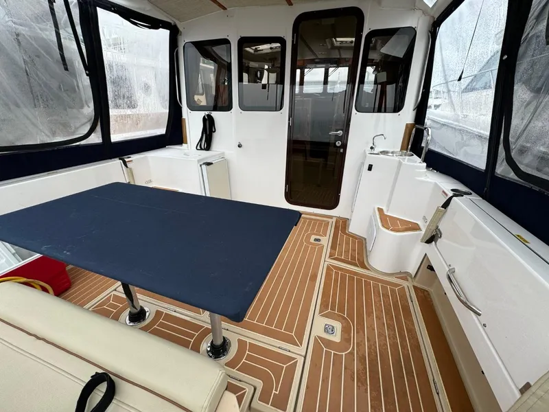 Slide: The Image of 2018 Ranger Tugs R-31S Ranger Tug interior with table and seating area. - 9