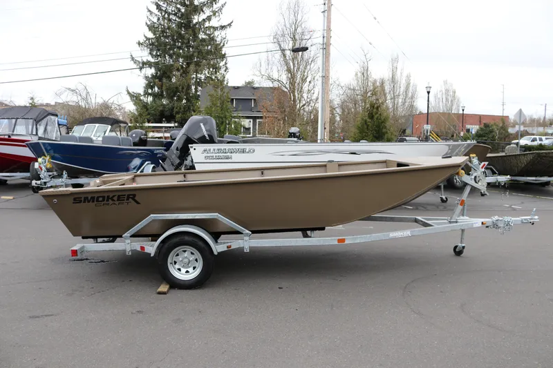 The Image of 2026 Smoker Craft Sportsman 1660 boat on trailer in outdoor setting. - 0