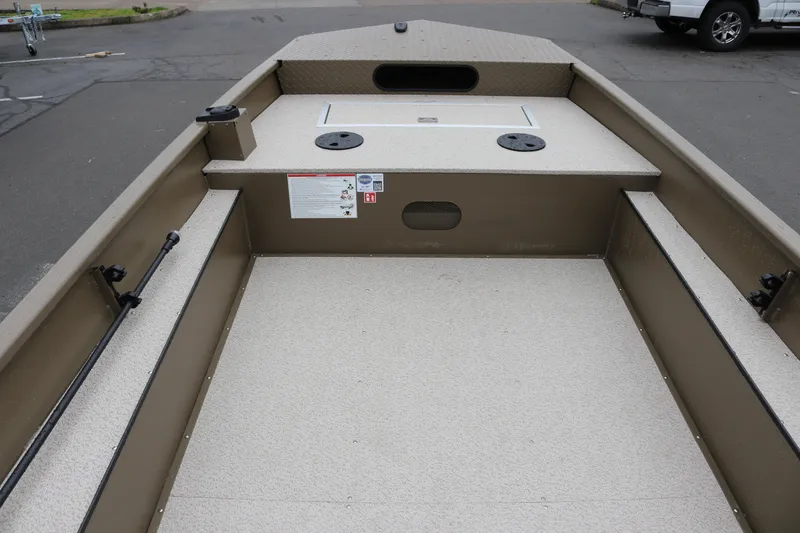 Slide: The Image of 2026 Smoker Craft Sportsman 1660 boat interior with spacious deck and storage compartments. - 10