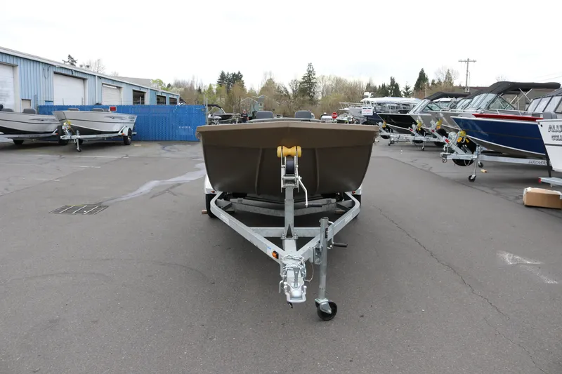 Slide: The Image of 2026 Smoker Craft Sportsman 1660 boat on trailer in outdoor dealership lot. - 3