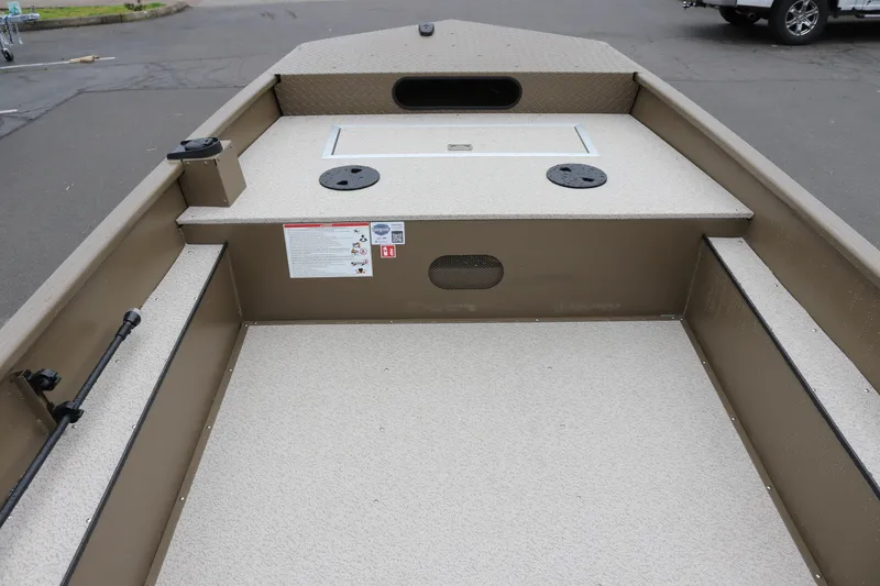 Slide: The Image of 2026 Smoker Craft Sportsman 1660 boat interior with spacious deck and storage compartments. - 4