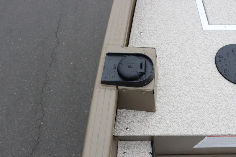 Slide: The Image of 2026 Smoker Craft Sportsman 1660 boat detail with raindrops on deck. - 7