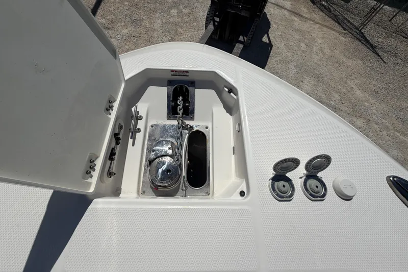 Slide: The Image of 2020 Robalo R272 Center Console anchor compartment with winch and chain. - 10