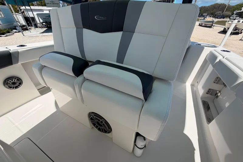 Slide: The Image of 2020 Robalo R272 Center Console boat seating with sleek white and gray upholstery. - 12