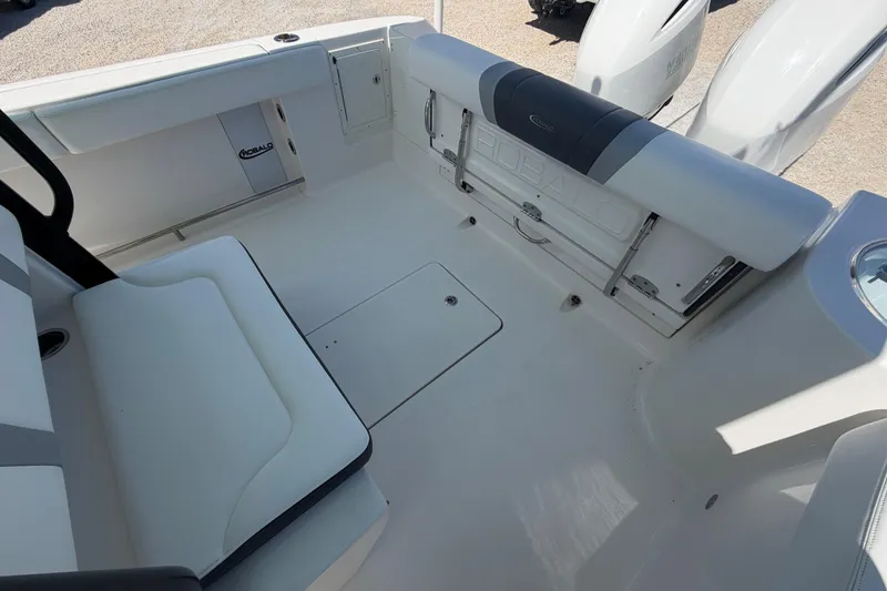 Slide: The Image of 2020 Robalo R272 Center Console boat interior with seating and storage compartments. - 14