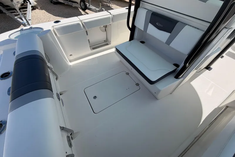 Slide: The Image of 2020 Robalo R272 Center Console boat interior with seating and storage compartments. - 15