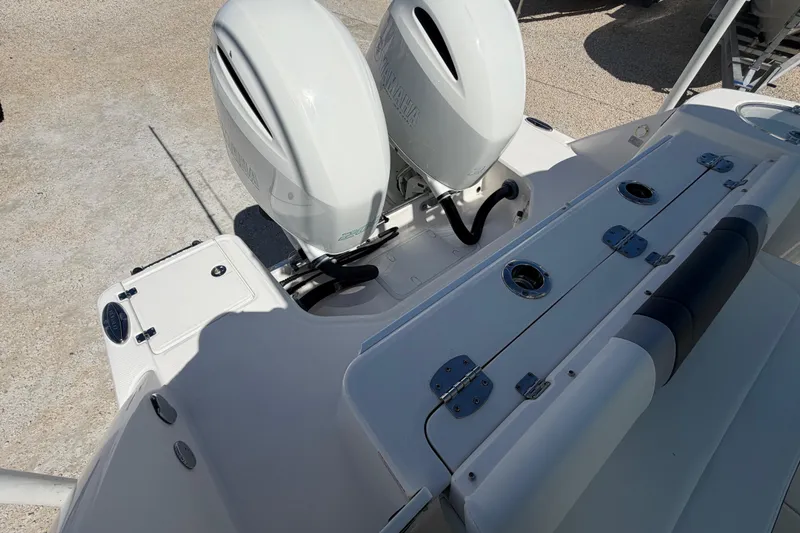 Slide: The Image of 2020 Robalo R272 Center Console boat with dual outboard engines. - 19