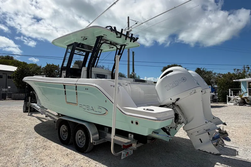 Slide: The Image of 2020 Robalo R272 Center Console boat with Yamaha engine on trailer. - 3