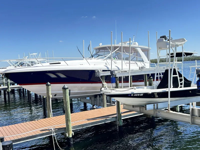 Slide: The Image of 2018 Intrepid 475 Sport Yacht at dock, sunny day. - 11