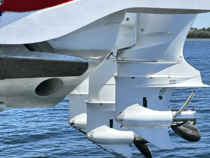 Slide: The Image of Intrepid 475 Sport Yacht 2018 outboard motors on calm water. - 13